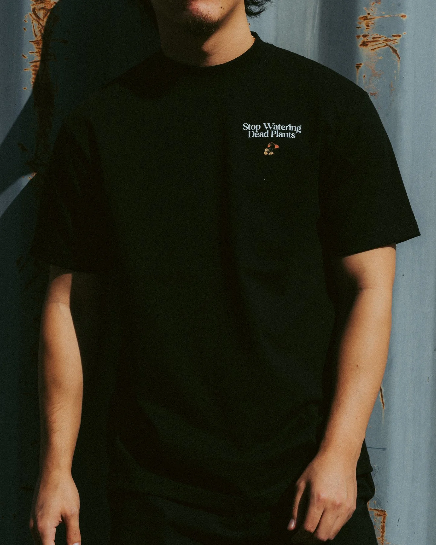 Stop Watering Dead Plants | Heavyweight Black Graphic Tee - Image 3